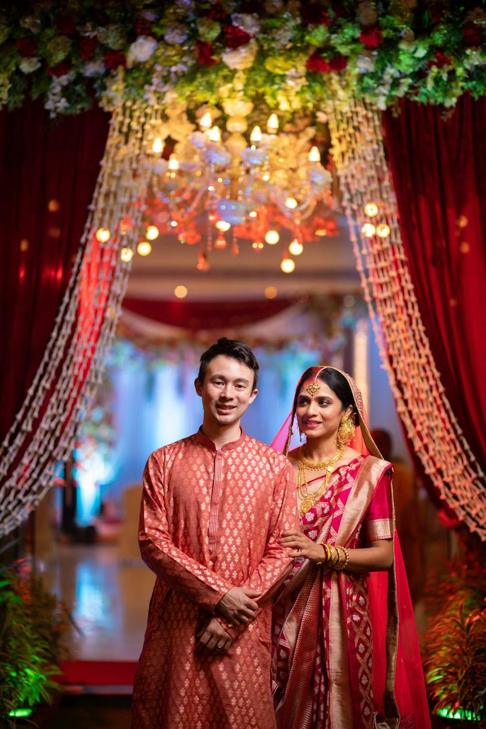 Groom posing with his bride after wedding