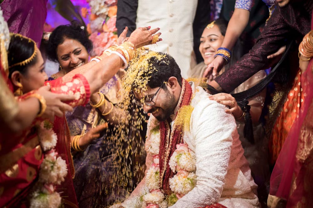 A beautiful wedding ceremony captured with groom in white chikankari sherwani