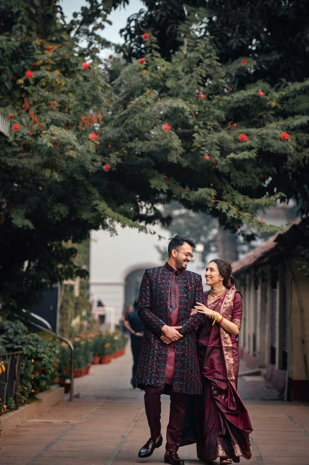 Groom looking dashing in Ajkan sherwani with his bride