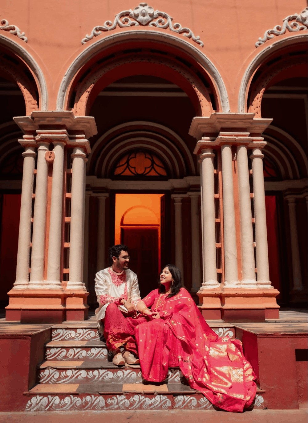 Young couple chatting on the stairs at North Kolkata Pre-Wedding Photoshoot | Memories Designer