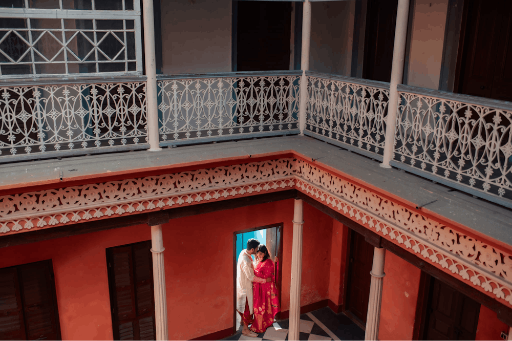 Young couple near a door at North Kolkata Pre-Wedding Photoshoot | Memories Designer