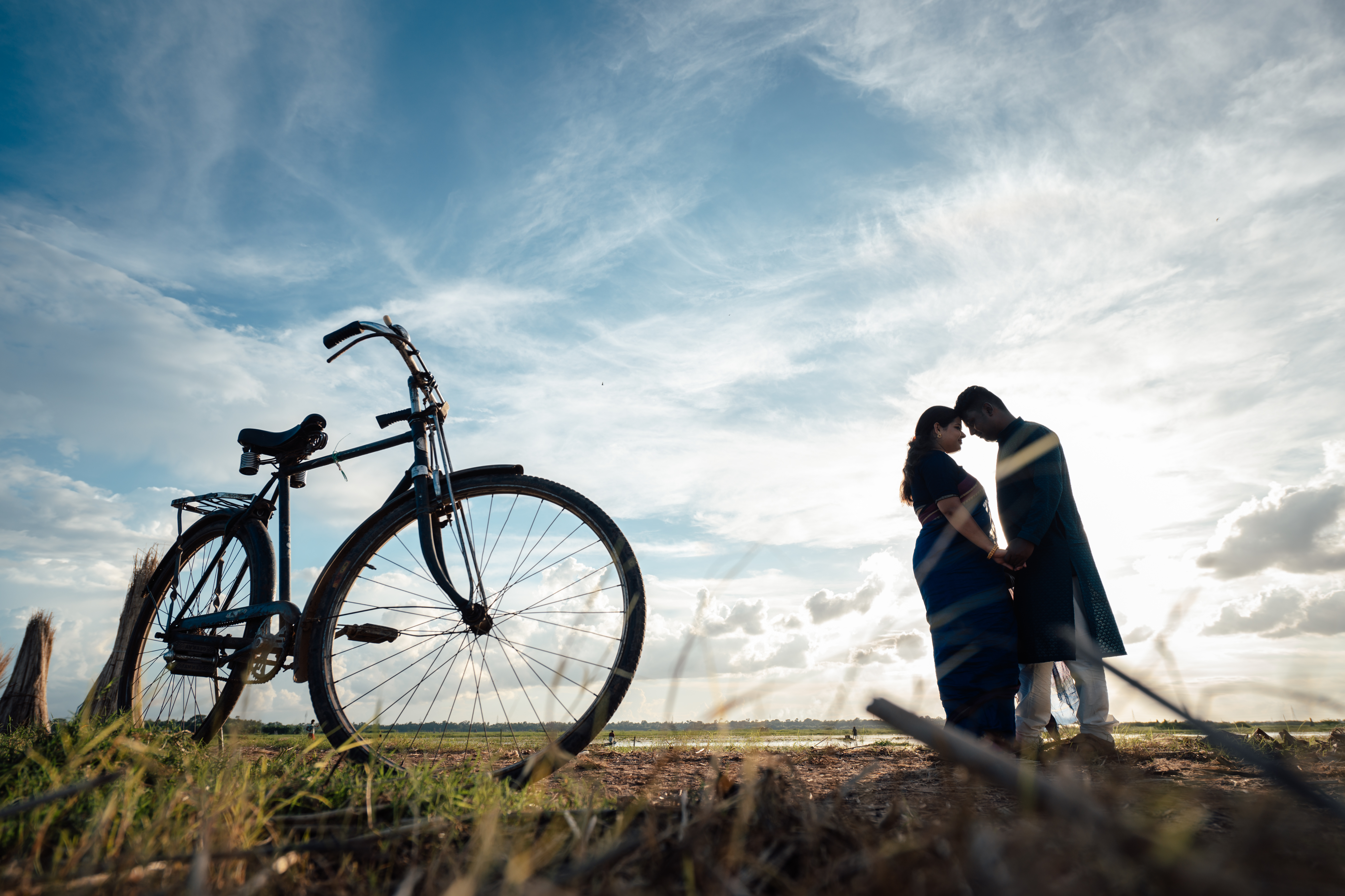 Bengali couple on the fields and near bicycle Pre-Wedding Photoshoot | Memories Designer