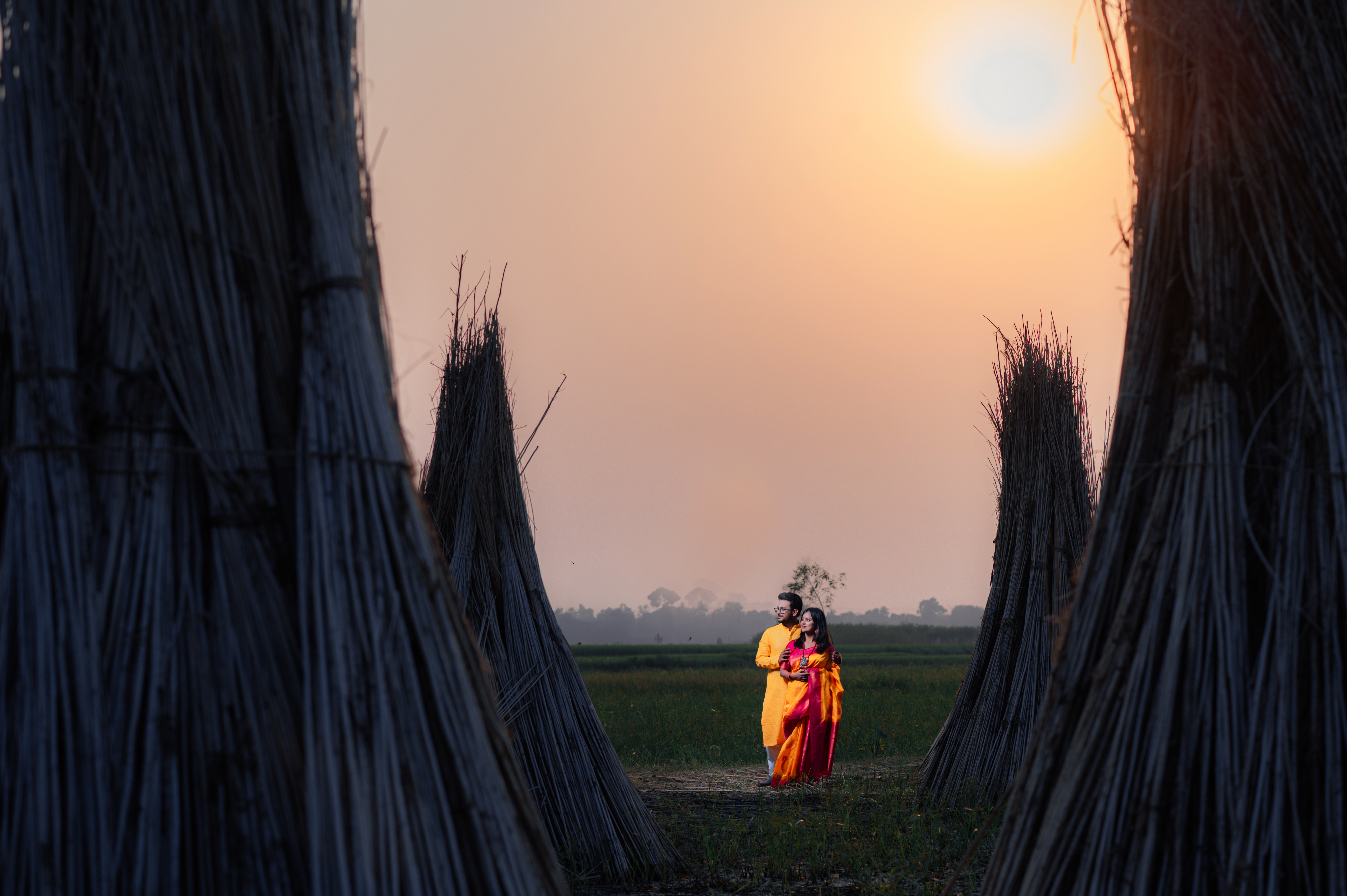 Bengali couple on the fields with sunset for Pre-Wedding Photoshoot | Memories Designer