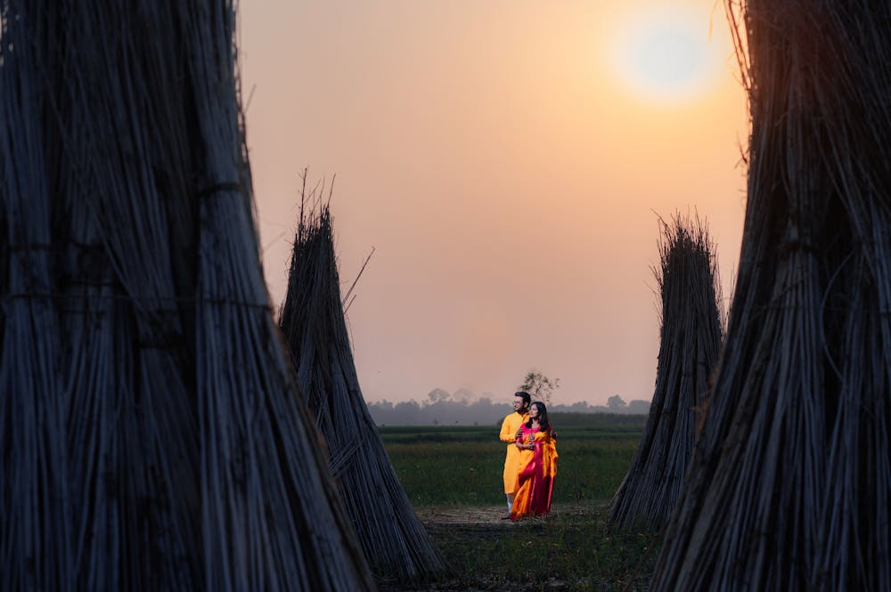 Bengali couple on the fields with sunset for Pre-Wedding Photoshoot | Memories Designer