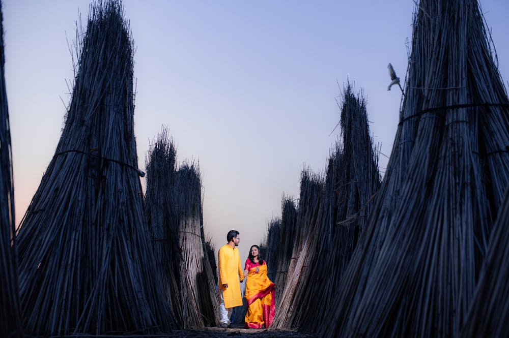 Bengali Couple walking on the fields Pre-Wedding Photoshoot | Memories Designer