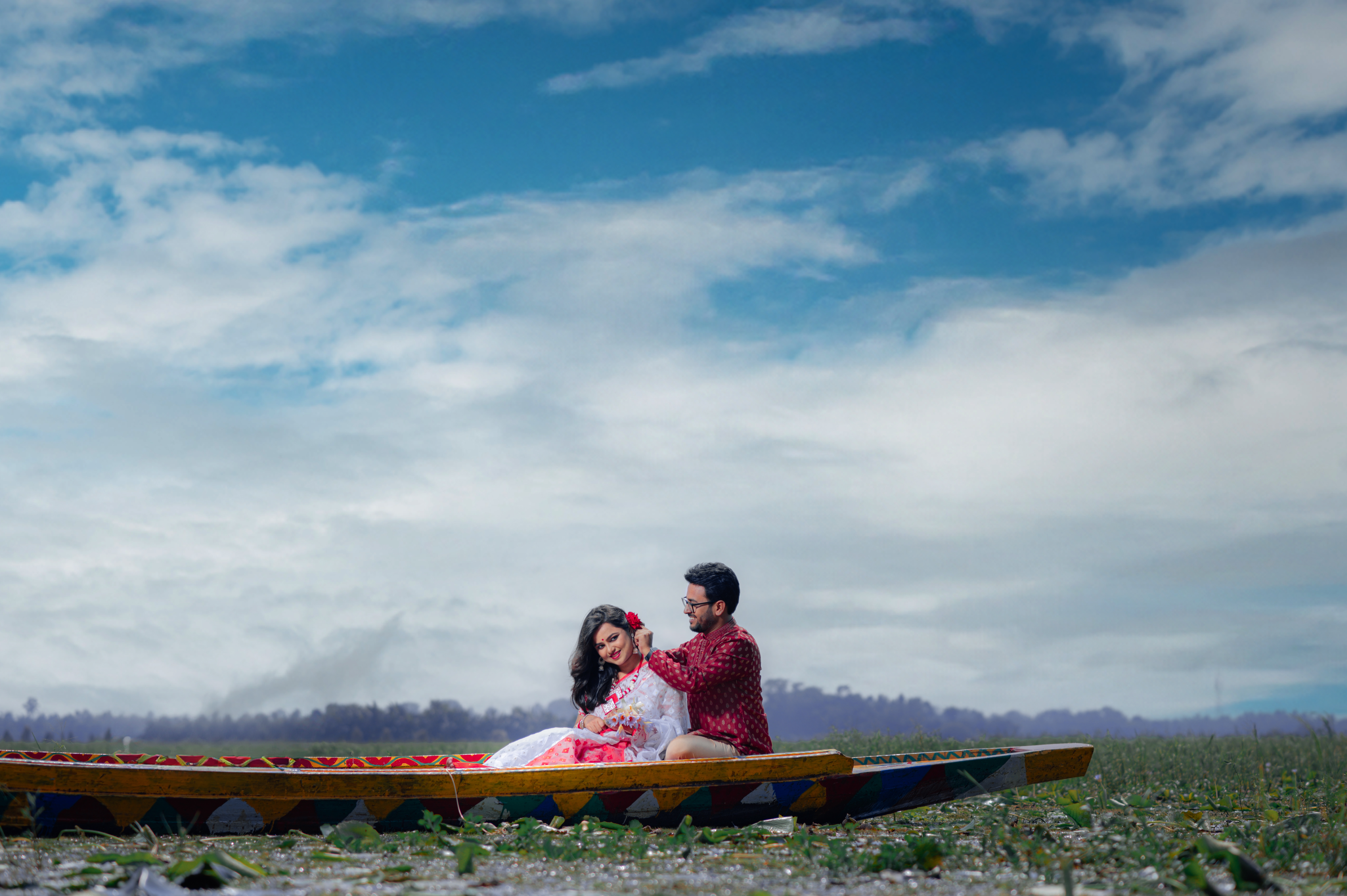 Bengali groom fixing bride's hair Pre-Wedding Photoshoot | Memories Designer