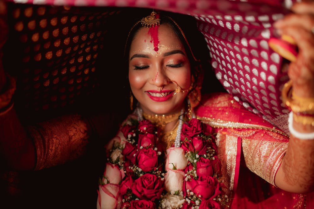 Udita's vibrant red-golden Benarasi saree look