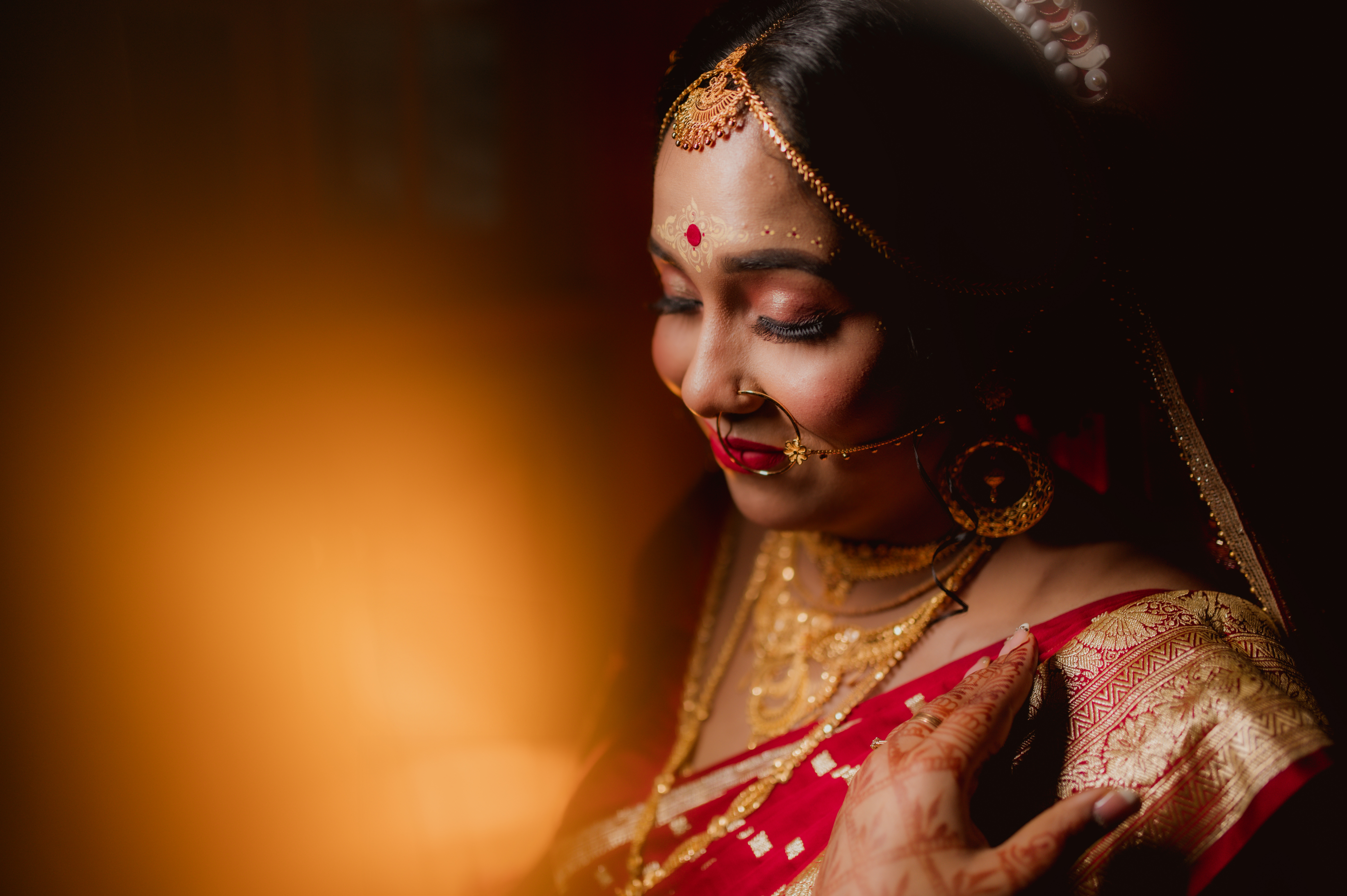 Udita's vibrant red-golden Benarasi saree look