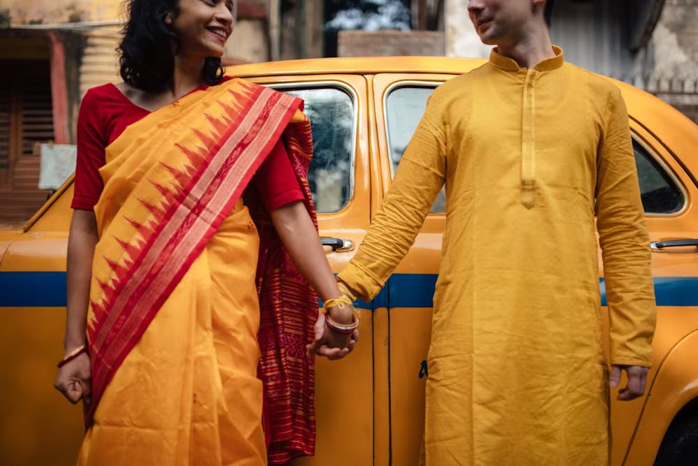 Indian couple holding hands for traditional pre wedding photoshoot | Memories Designer
