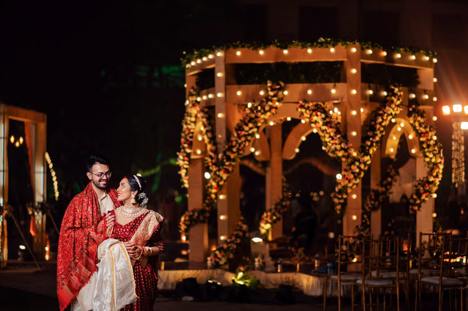 Bengali bride and groom near well-lit wedding venue | Cinematic wedding photoshoot | Memories Designer