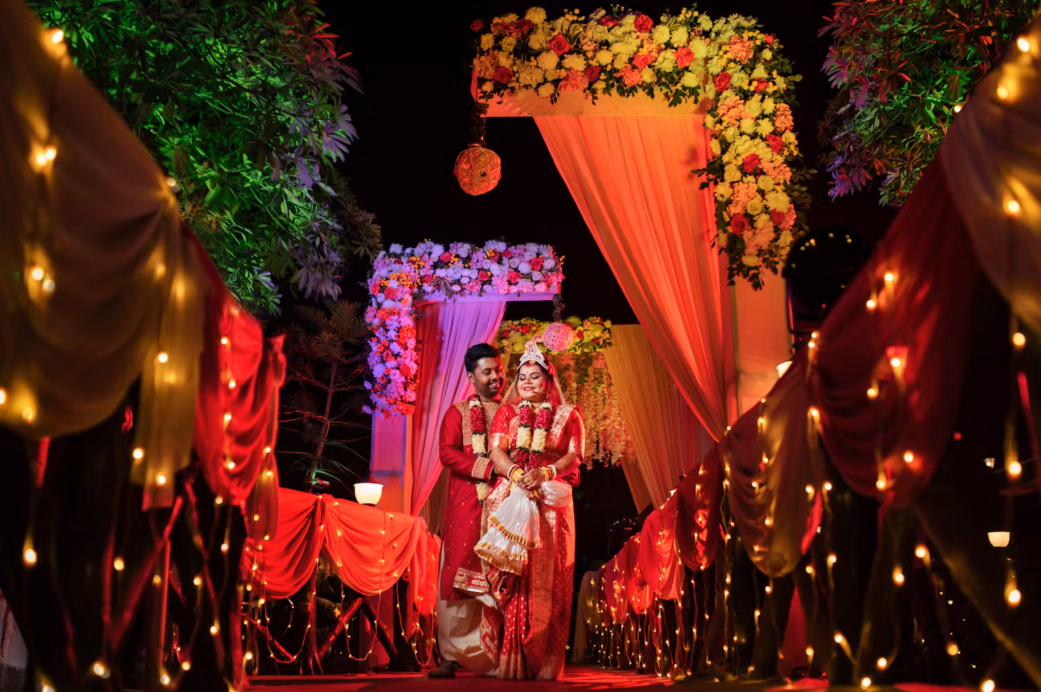 Bengali bride and groom at wedding venue with fairy lights | Cinematic wedding photoshoot | Memories Designer