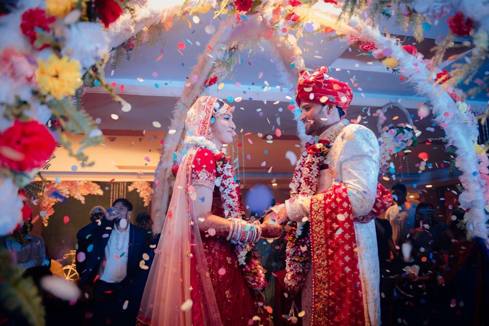 Confetti showed on Indian bride and groom | Cinematic wedding photoshoot | Memories Designer