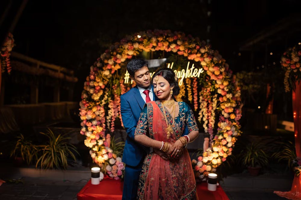 Indian bride and groom posing for photoshoot | Wedding reception | Memories Designer