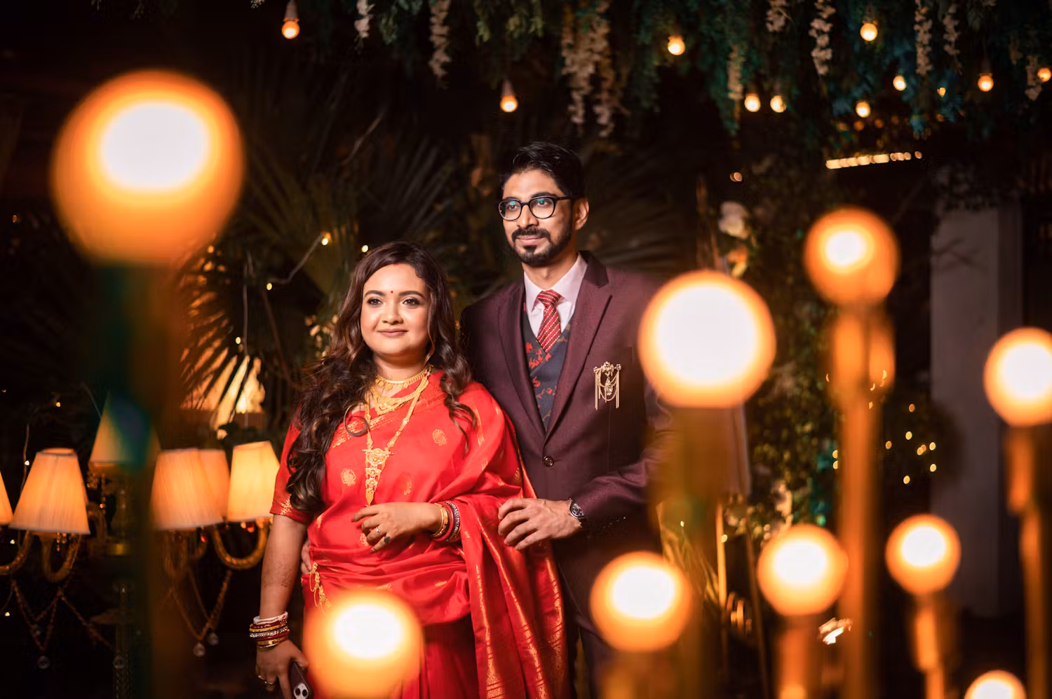Indian bride and groom near fairy lights | Wedding reception | Memories Designer