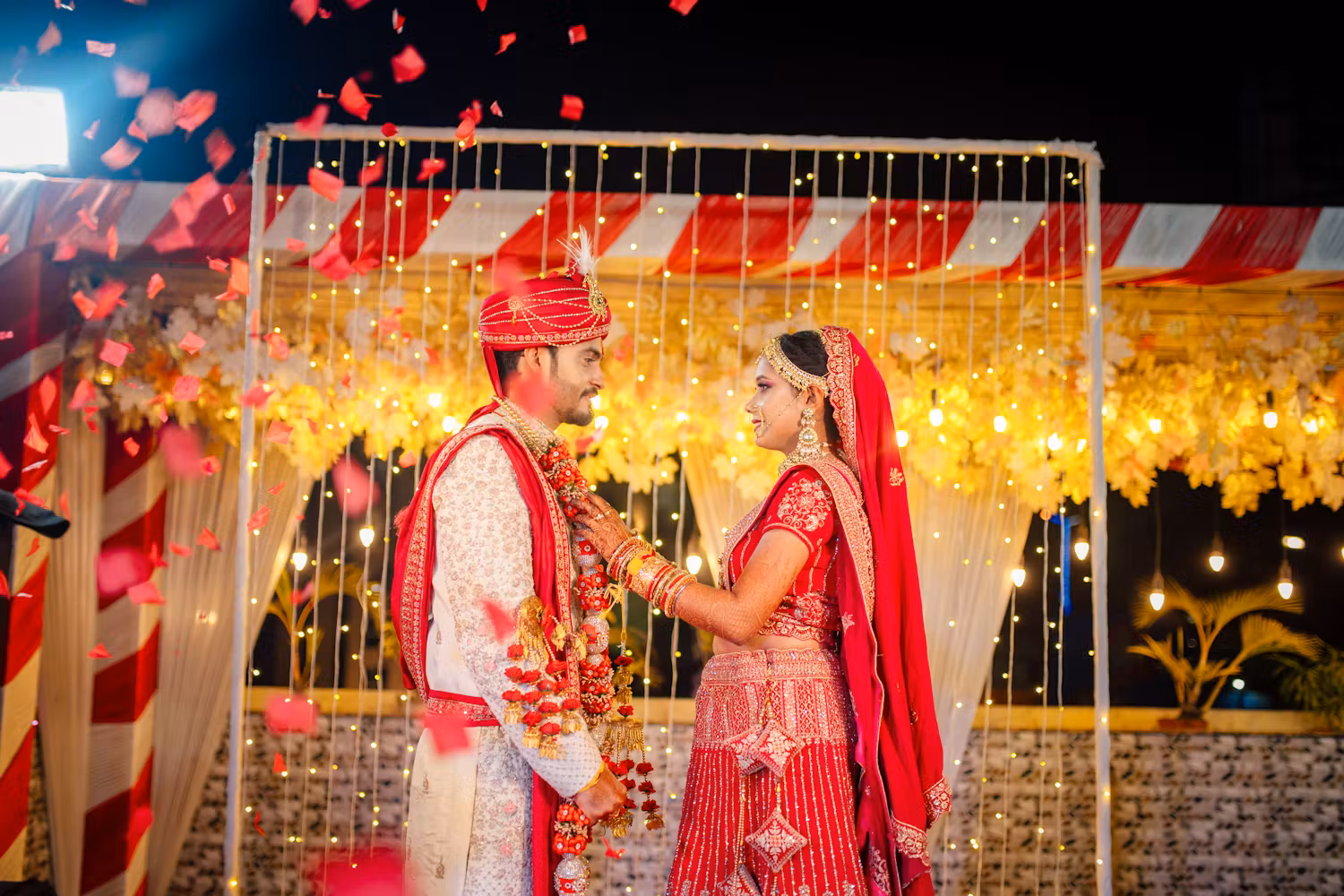 Indian bride and groom garland exchange ceremony | Themed wedding photography | Memories Designer