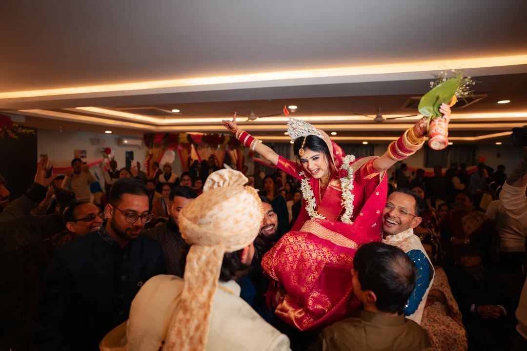 Funny wedding photography ideas of Indian bride in front of groom at wedding ceremony.