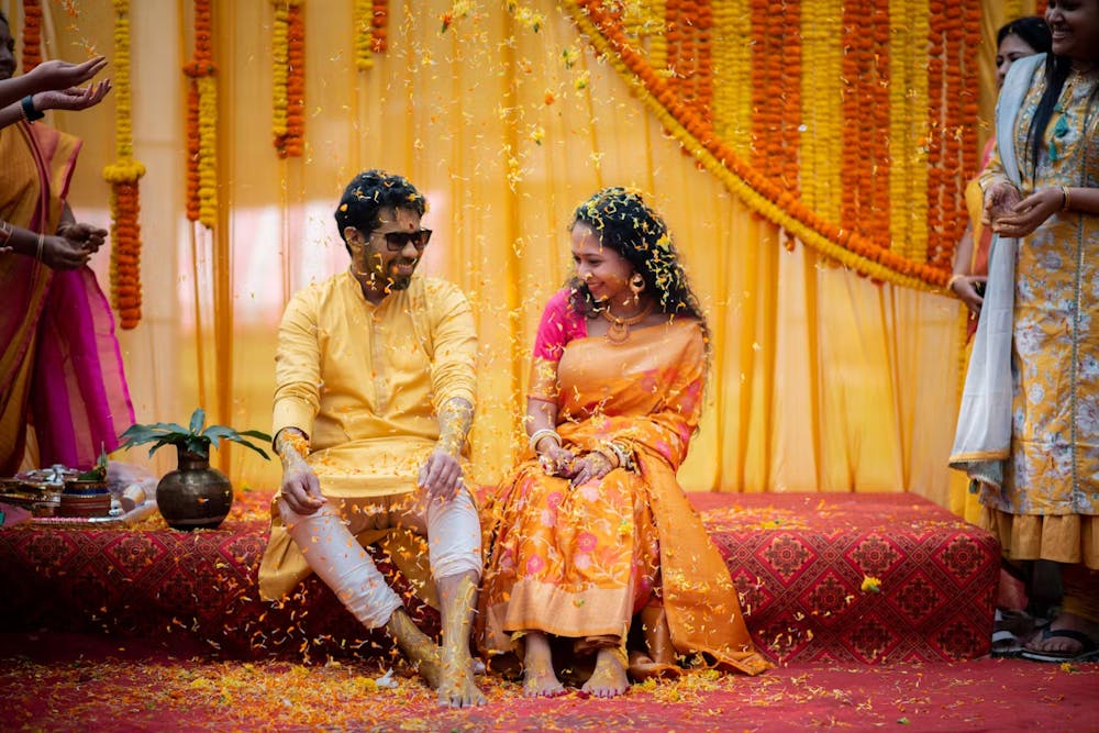 Creative wedding photography ideas for Bengali bride and groom during Haldi ceremony | Memories Designer