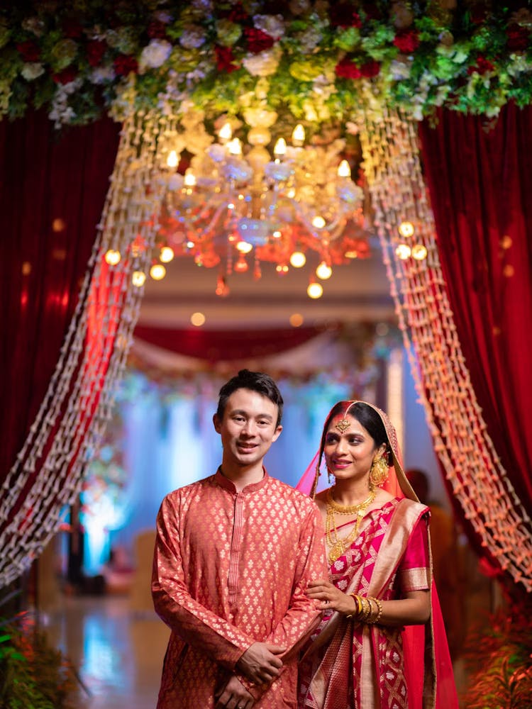 Couple wedding photo with focus on Groom reception dress