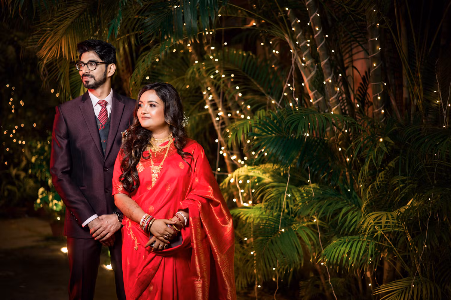 Groom posing with his bride in reception day