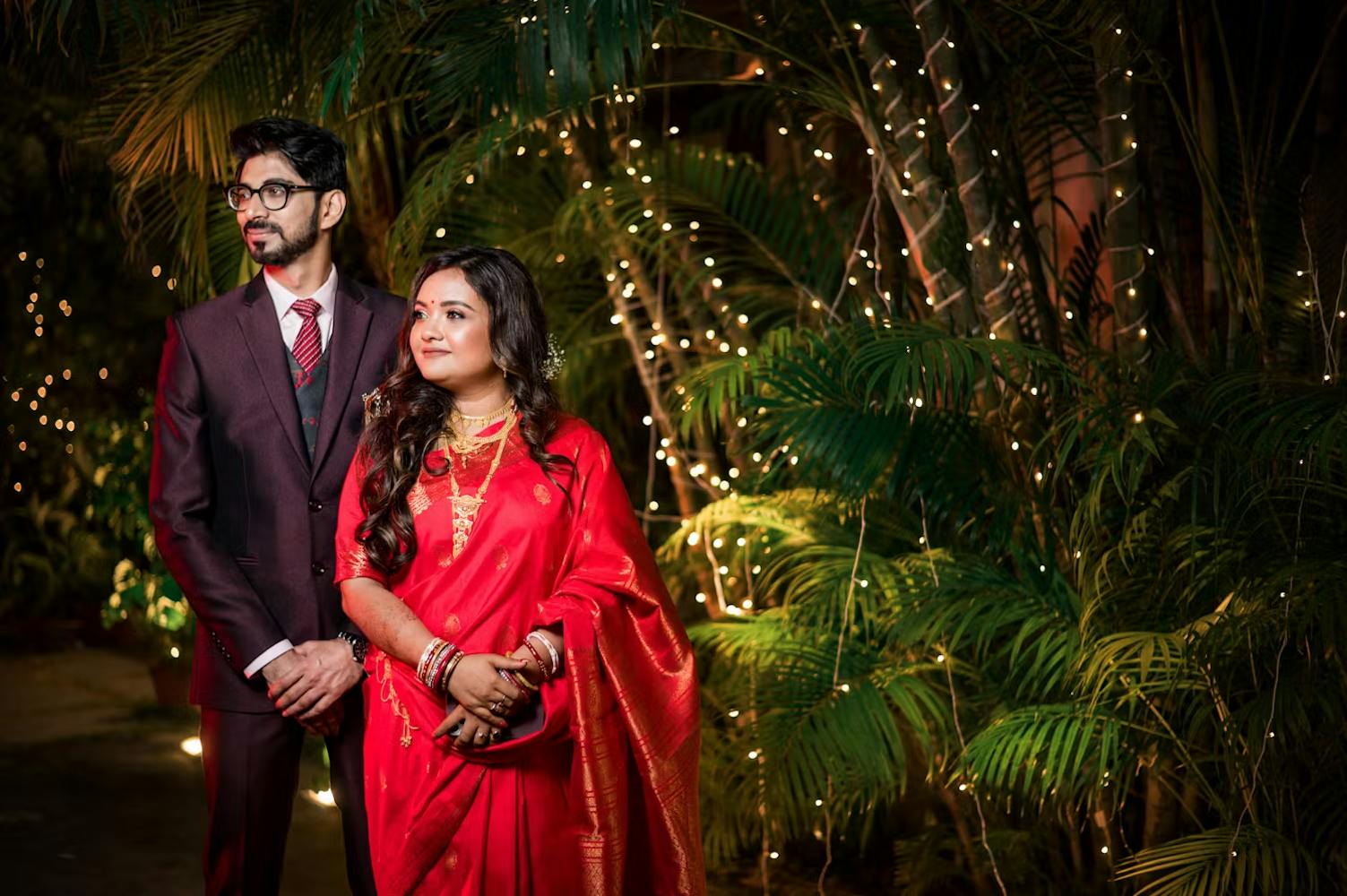 Groom posing with his bride in reception day