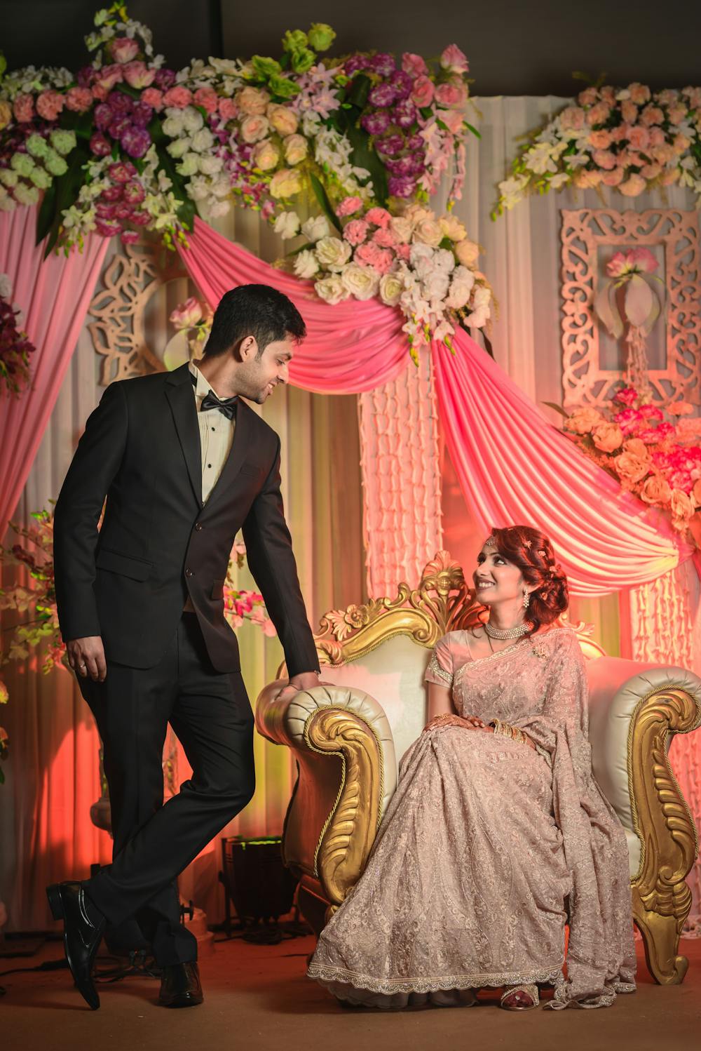Groom in coat and pant with bride