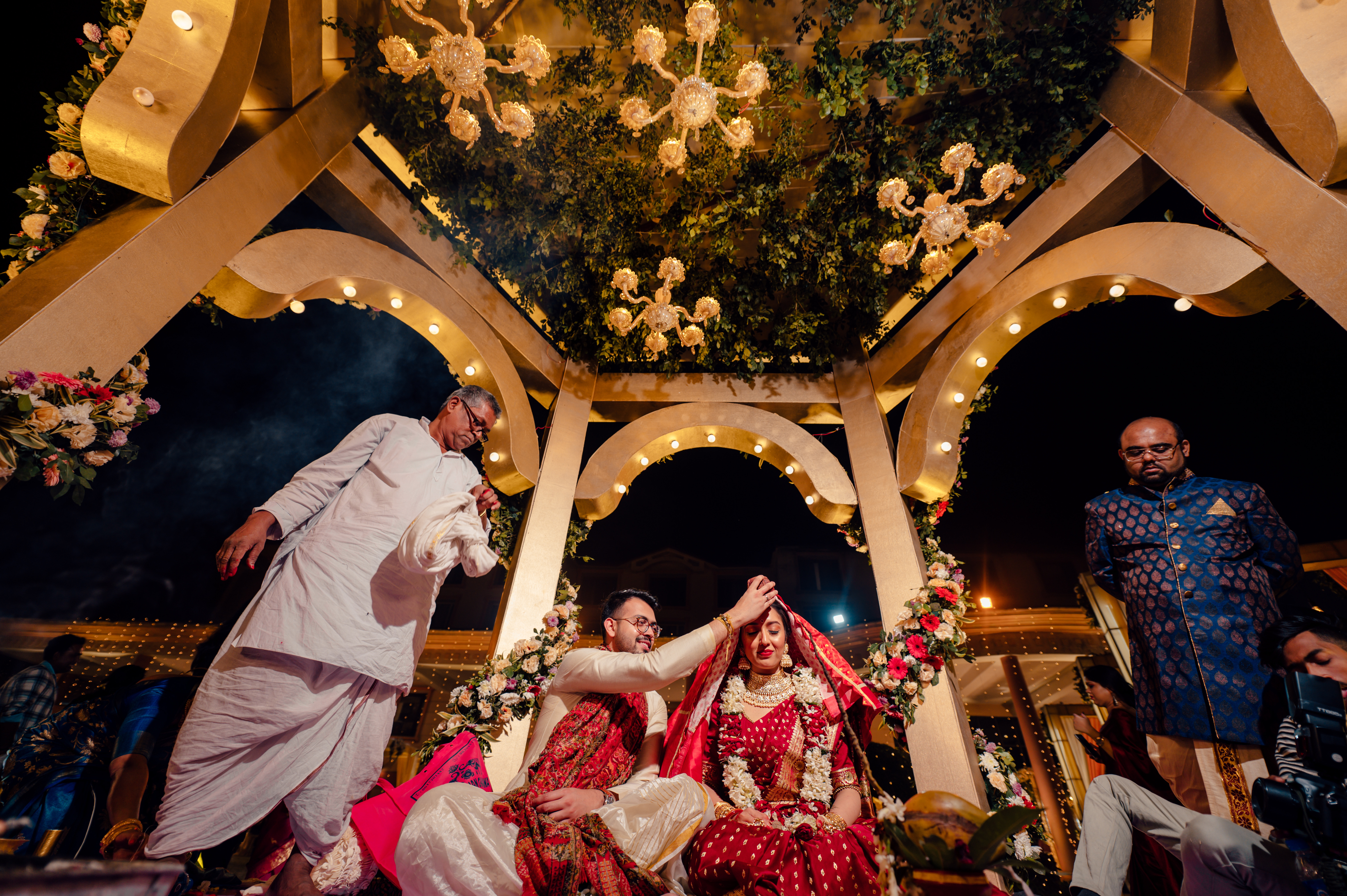 Groom putting Sindoor on bride's forehead pic
