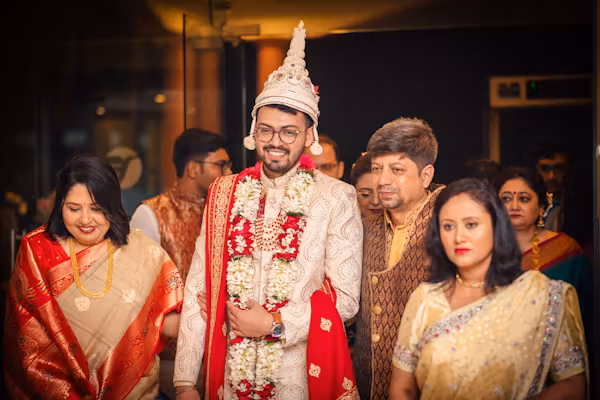 Groom with family on wedding day photoshoot