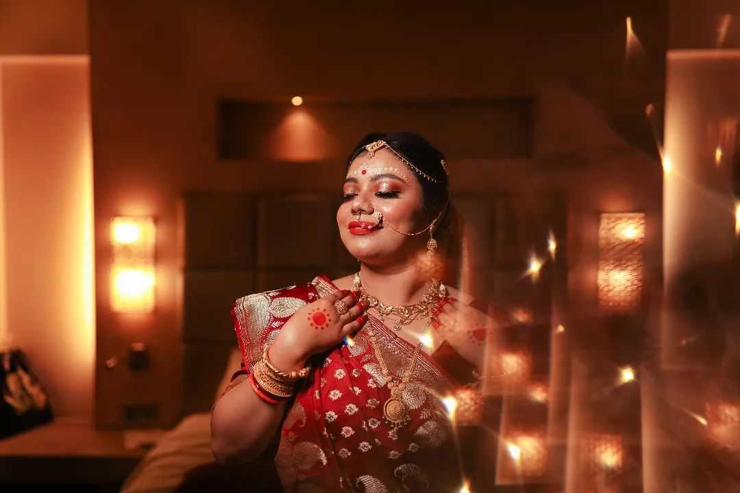Bride posing with her wedding accessories image