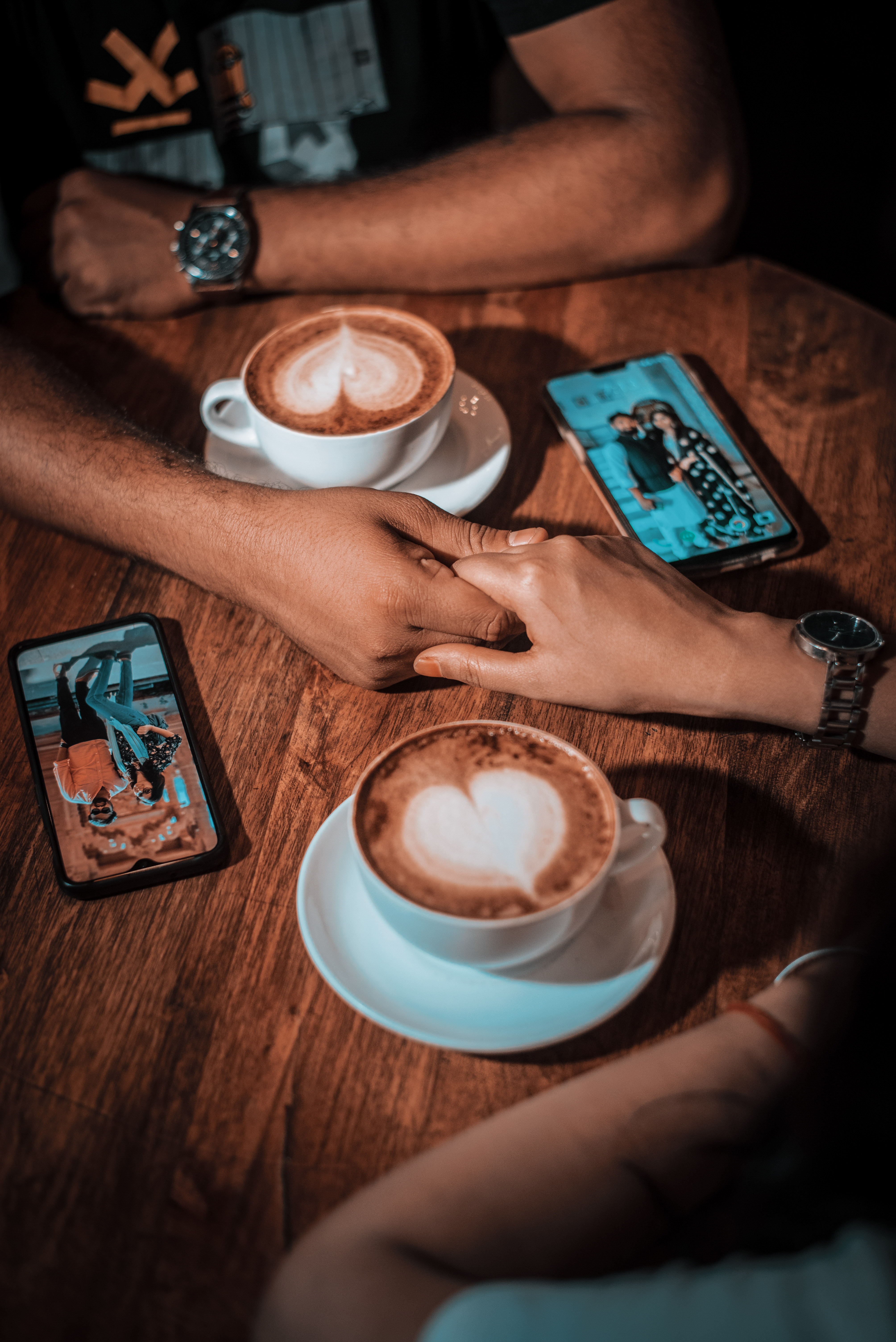 Couple holding hands in pre-wedding photography image