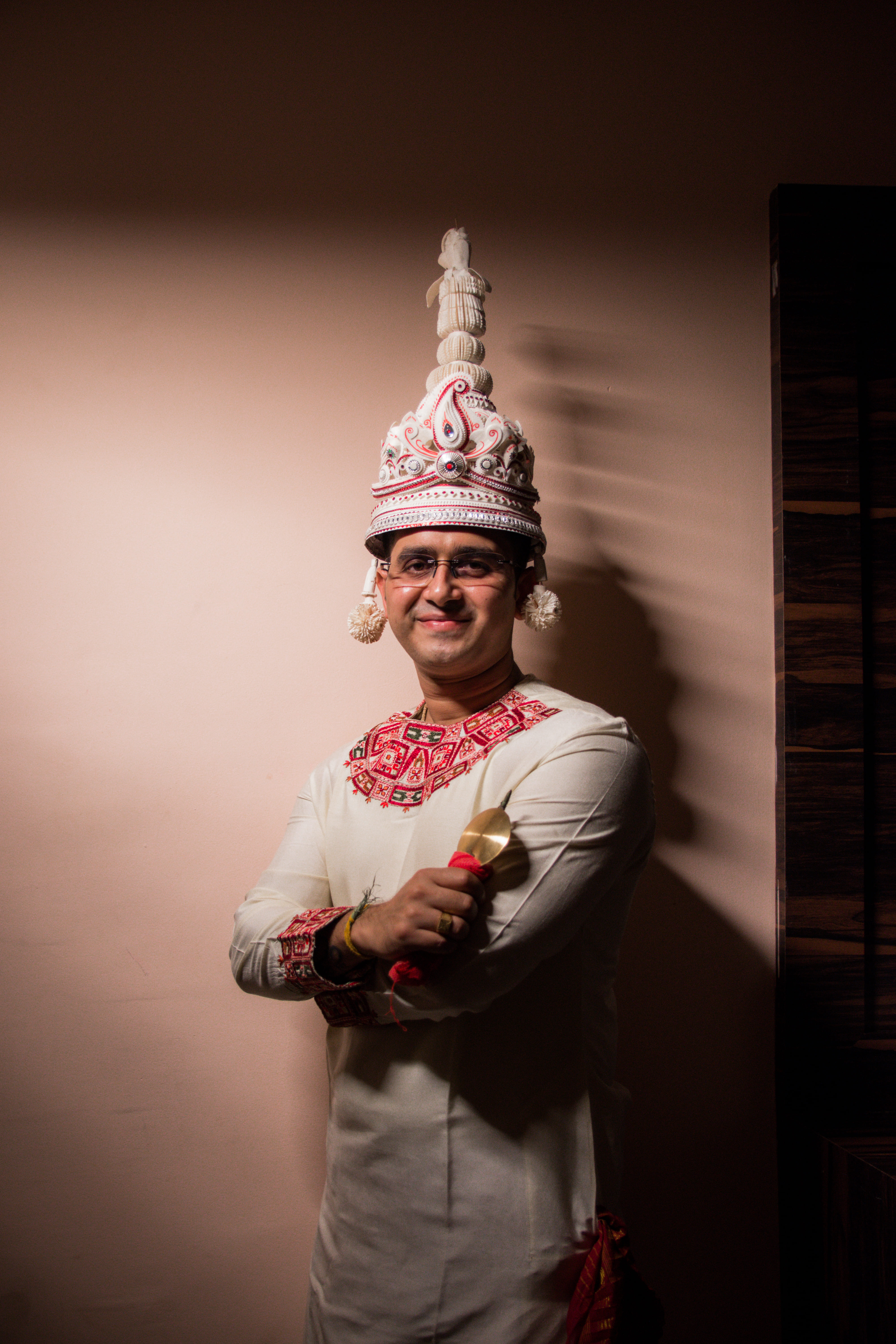 Groom posing in Bengali 'Topor' for a solo pic