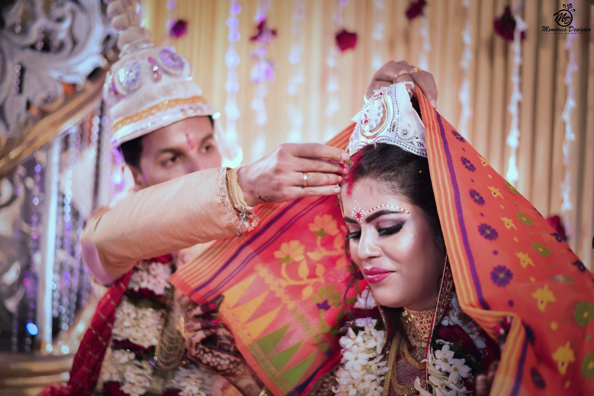 A shy bride wearing Sindoor on her wedding day pic