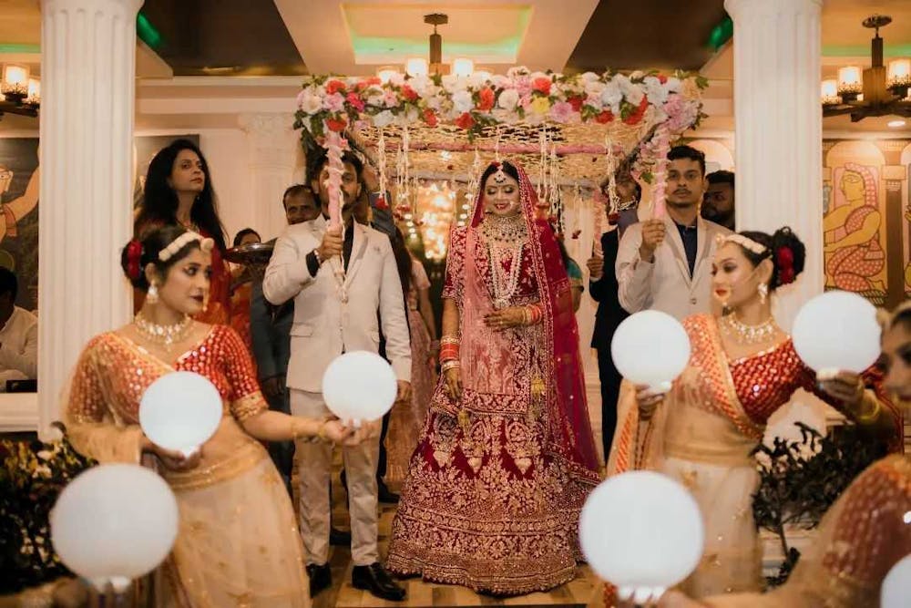 Bride entering her wedding venue pic