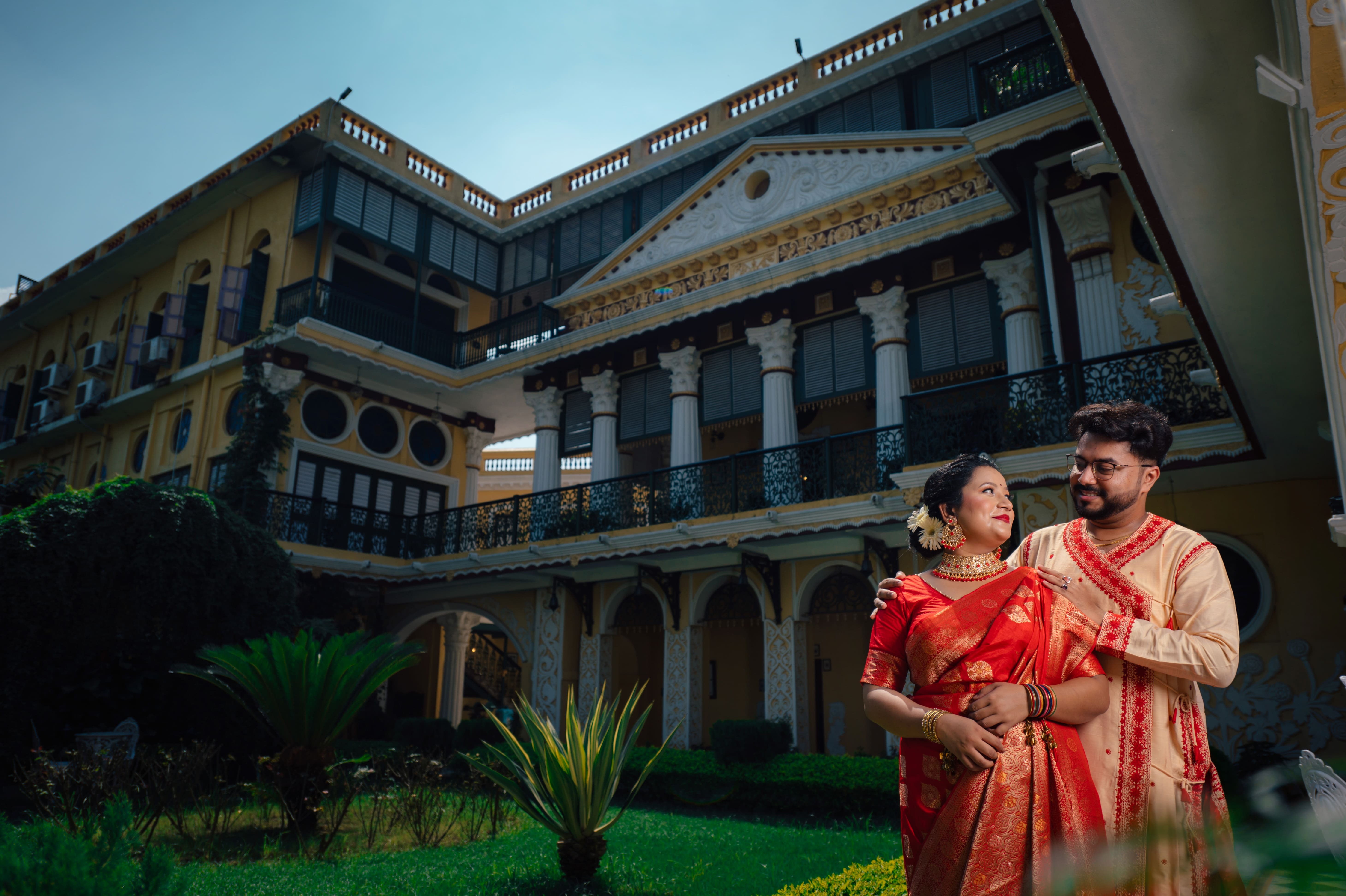 Groom holding arms of bride pic