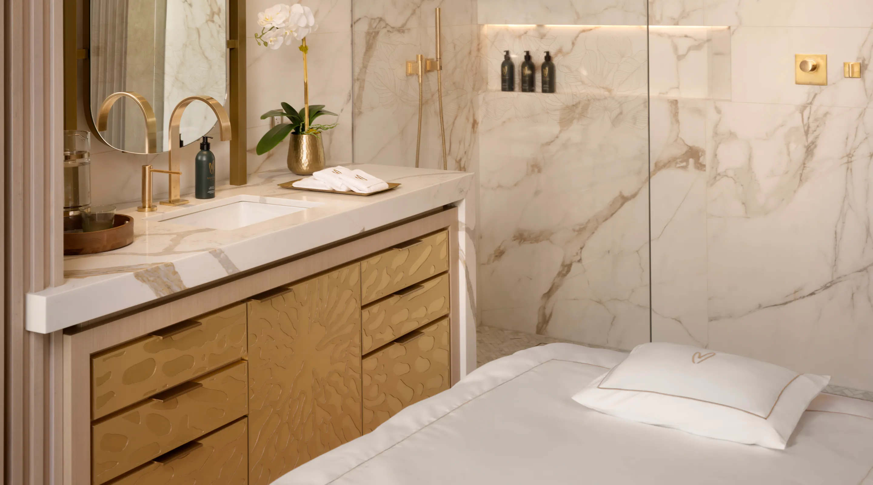Luxury Treatment Suite with marble shower and vanity at Meraki Wellness in Grand Cayman