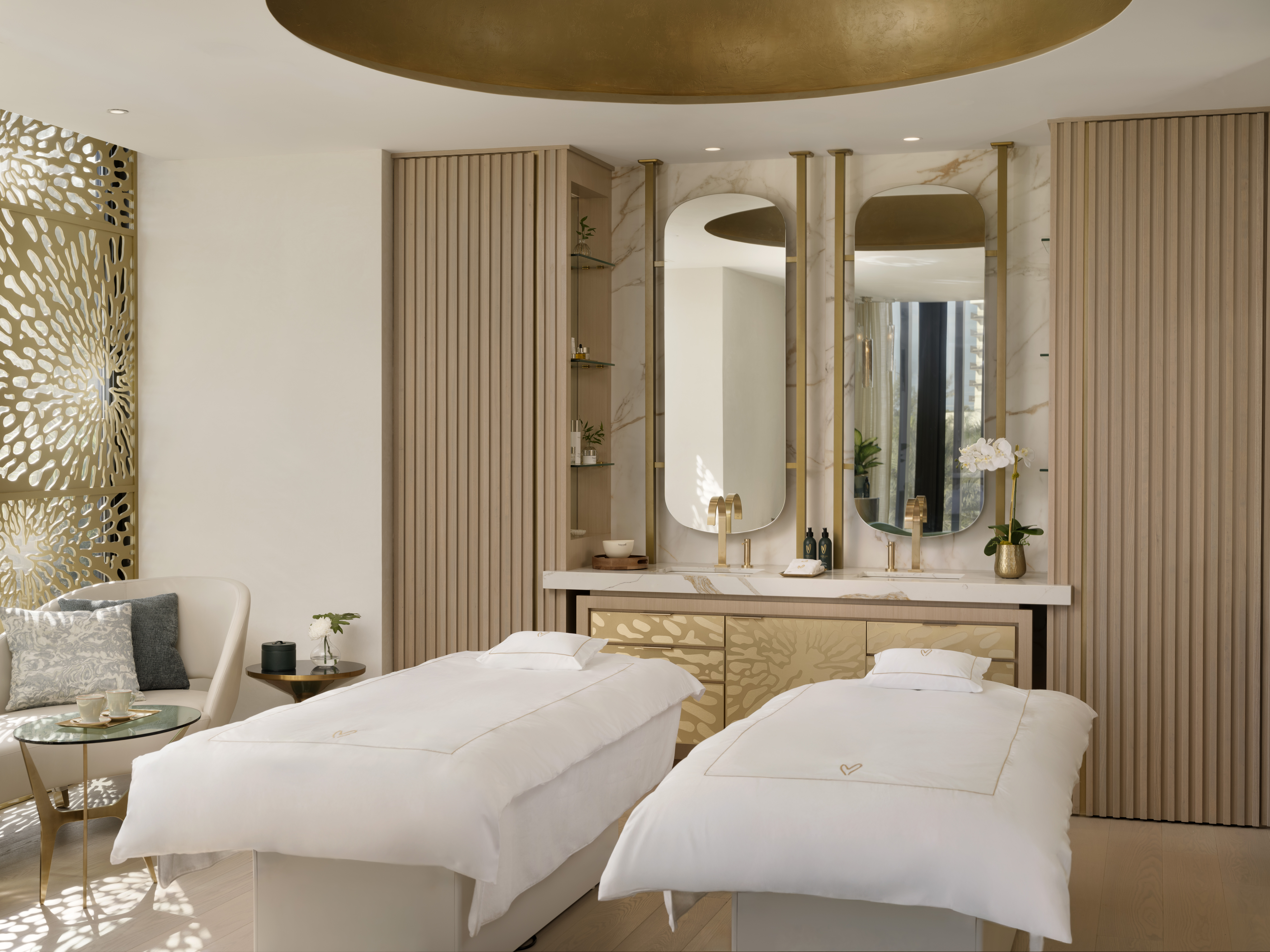 Two treatment beds in the Luxury Signature Suite for spa packages at Meraki Wellness in the Cayman Islands