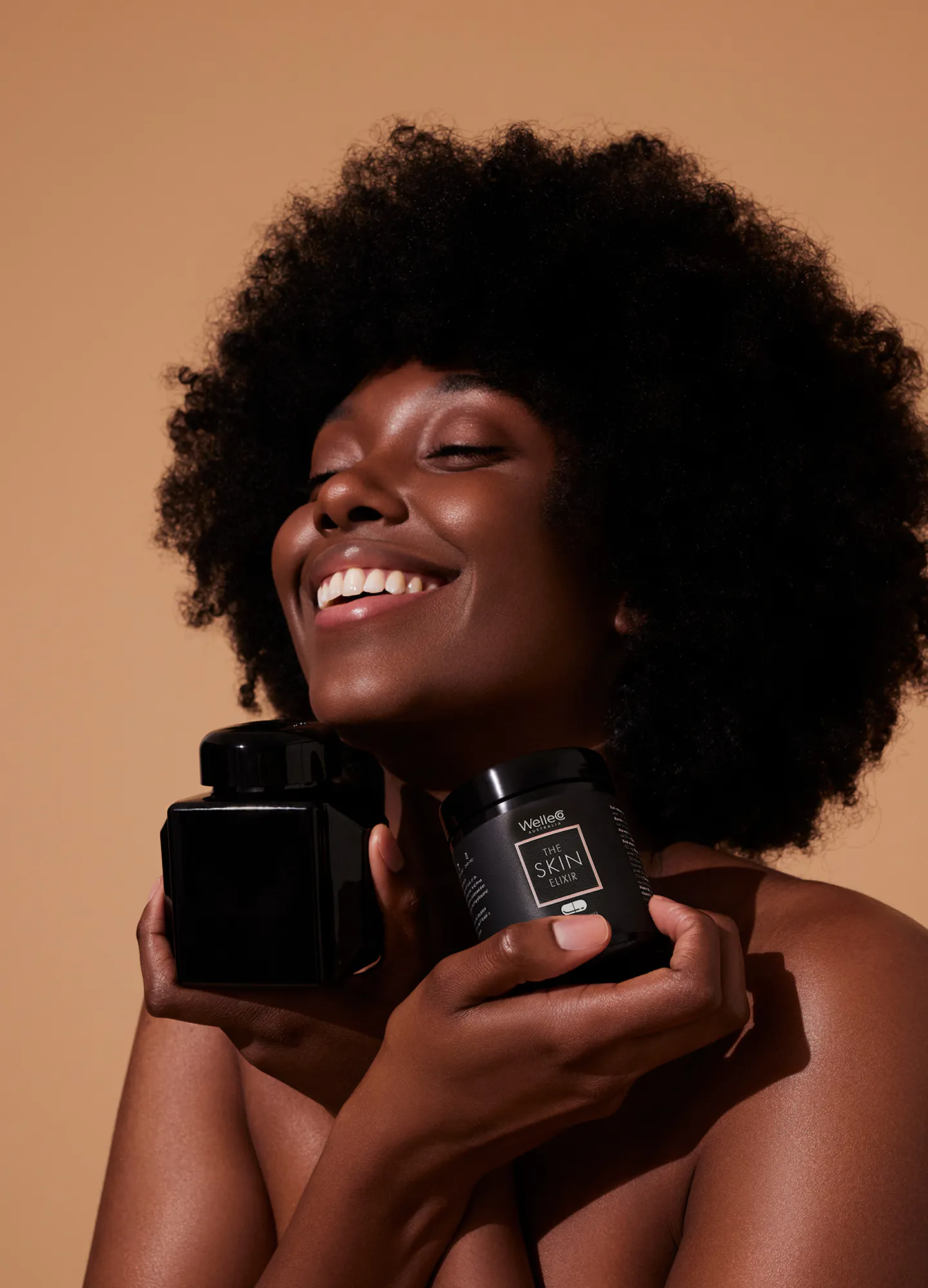 Female holding a WelleCo product