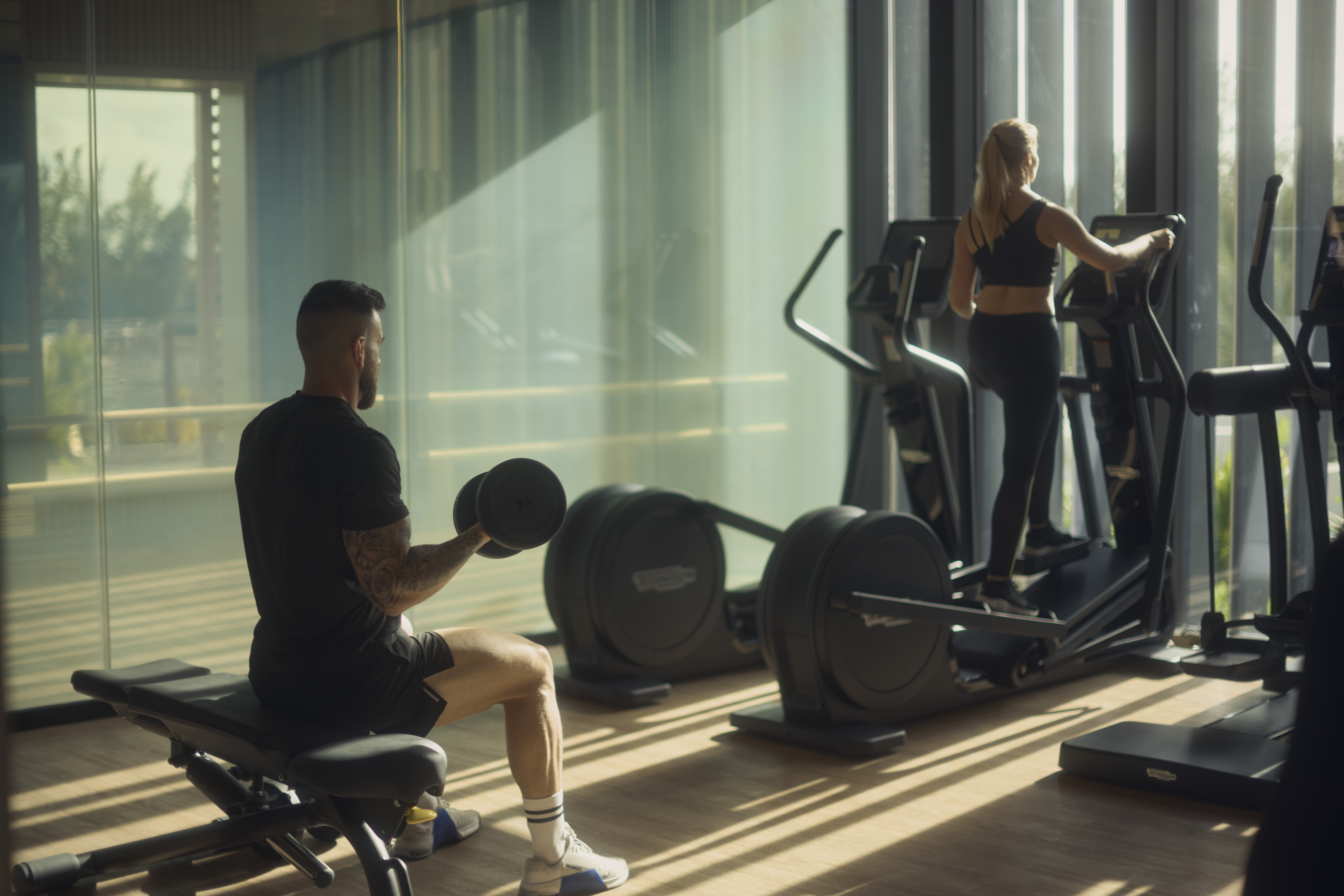 Meraki Wellness team members using Technogym equipment in the Fitness Lounge