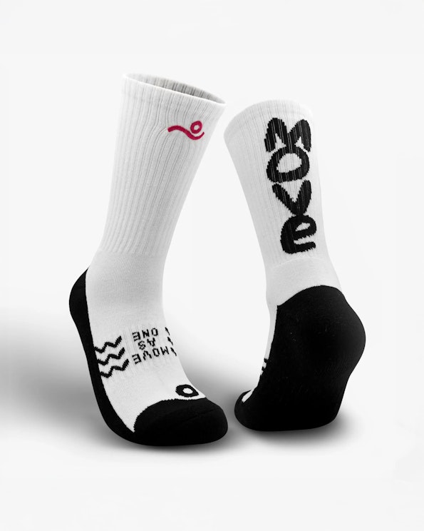 Full custom white and black knit crew socks with bold "Move" graphic and red logo, produced by MerchCamp
