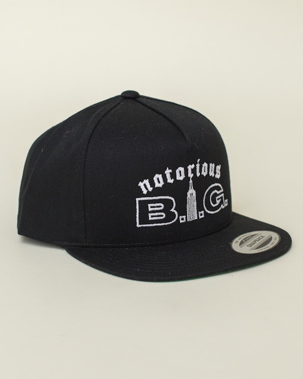 Embroidered black cotton snapback hat with white Notorious B.I.G. skyline logo, produced by MerchCamp for Biggie Smalls