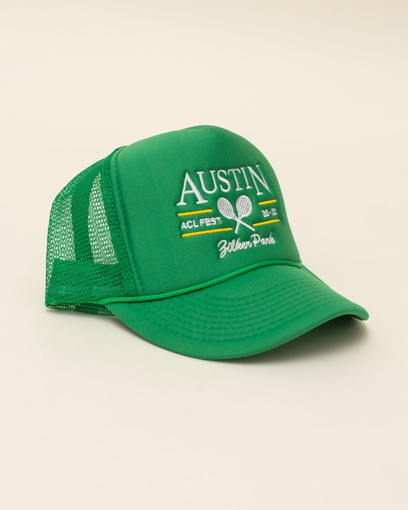 Embroidered green foam trucker hat with mesh back and tennis racket design, produced by MerchCamp for Live Nation