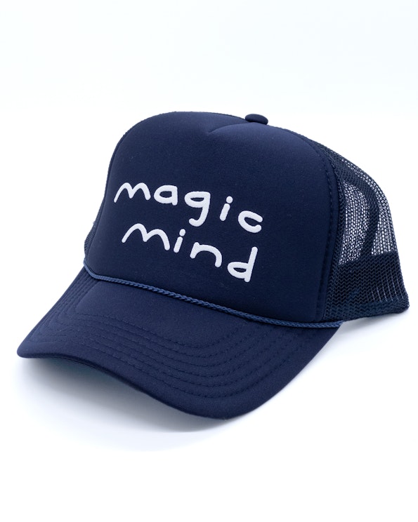 Puff printed navy foam trucker hat with white hand-drawn lettering and mesh back, produced by MerchCamp for Magic Mind