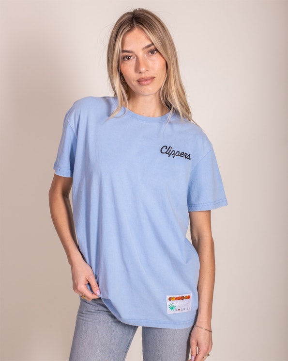 Custom light blue cotton tee with script chest lettering and woven hem label, produced by MerchCamp for LA Clippers