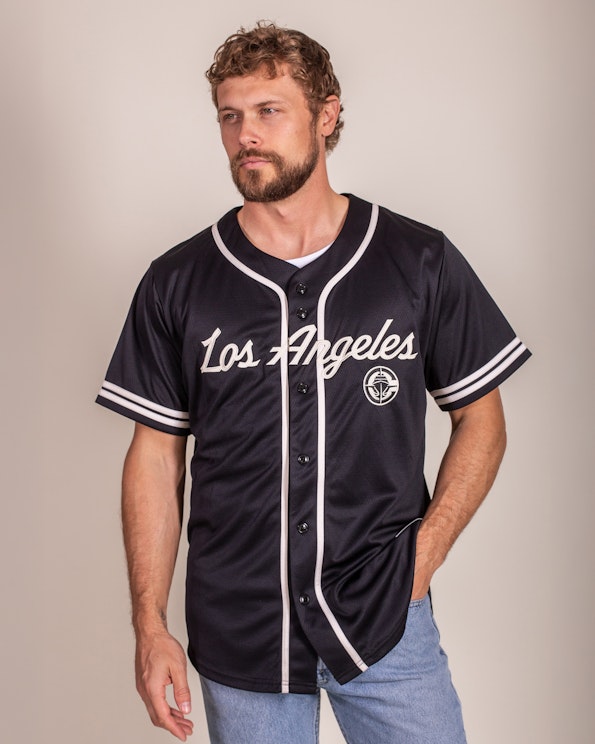 Full custom black mesh baseball jersey with white script lettering and striped trim, produced by MerchCamp for LA Clippers