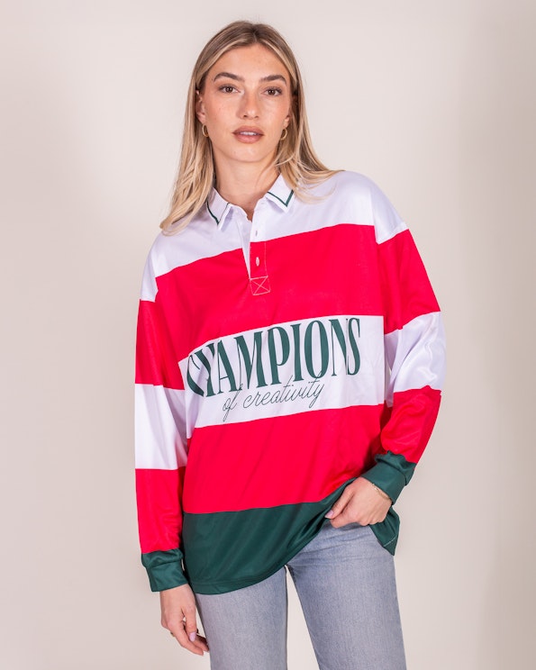 Full custom red and white striped rugby shirt with green "Champions" graphic, produced by MerchCamp for Eleanor