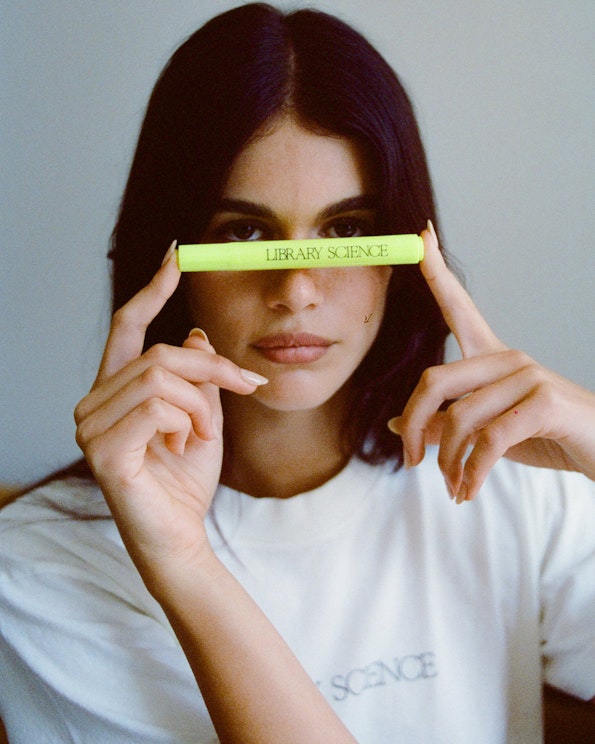 Custom neon yellow highlighter pen with dark "Library Science" branding text, produced by MerchCamp for Walk Up