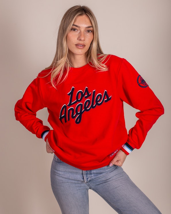 Chenille appliqué red fleece crewneck sweatshirt with cursive Los Angeles lettering and striped, produced by MerchCamp for LA Clippers
