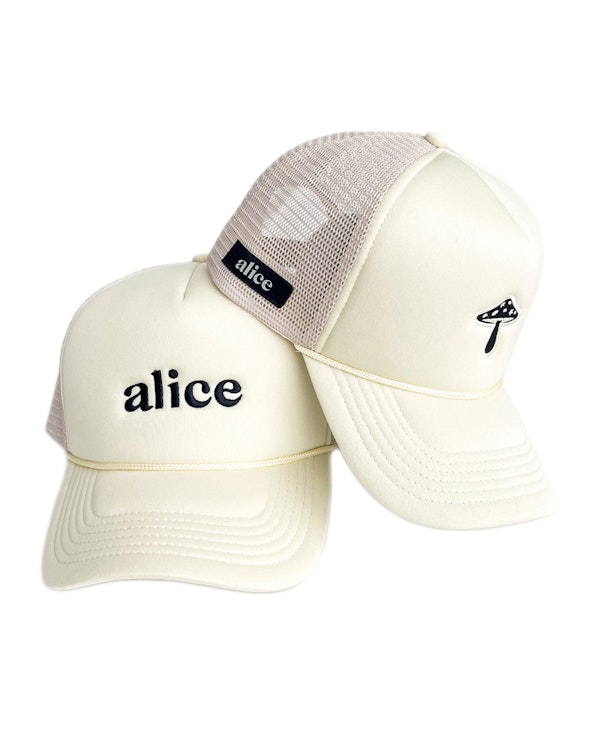 Embroidered cream foam trucker hat with mesh back, mushroom motif, and woven label, produced by MerchCamp for Alice Mushrooms