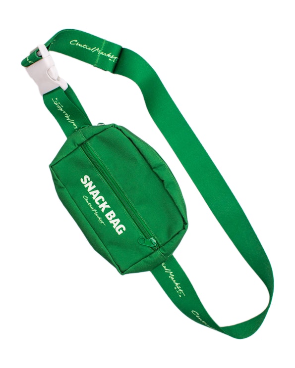 Full custom green nylon fanny pack with white "Snack Bag" print and branded strap, produced by MerchCamp for Central Market