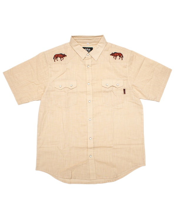 Embroidered tan chambray pearl snap western shirt with red coyote chest motifs, produced by MerchCamp for 18.21 Man Made