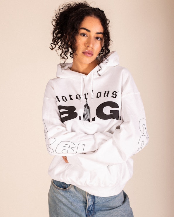 Screen printed white pullover hoodie with gothic Notorious B.I.G. skyline graphic, produced by MerchCamp for Biggie Smalls